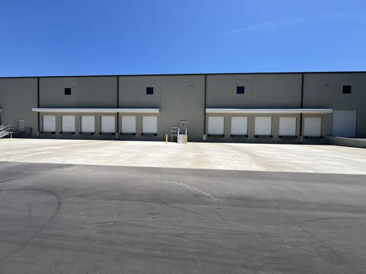 Completed Blackstone installation showing a row of white garage doors